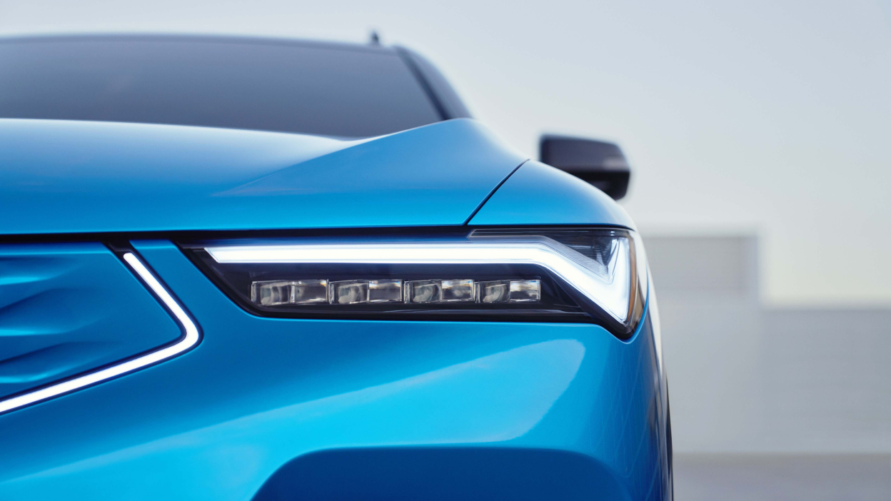 Macro closeup of headlight on blue ZDX.